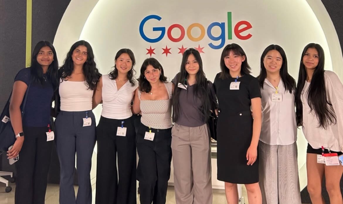 Group photo in front of the Google sign at Google’s Chicago office during the site visit