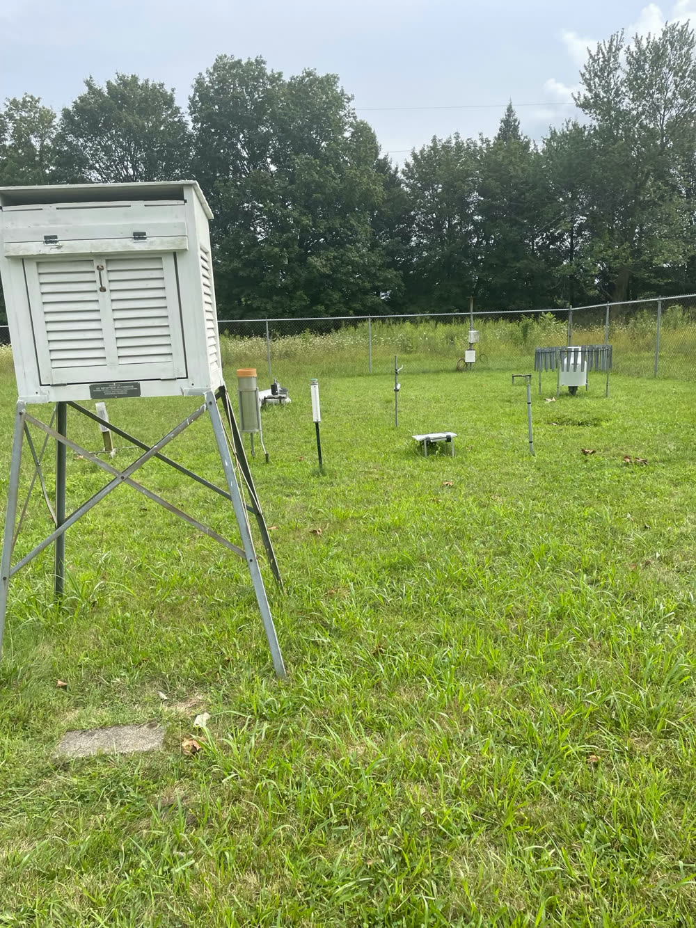 Instrument shelter and rain gauges inside a fenced Illinois Climate Network station